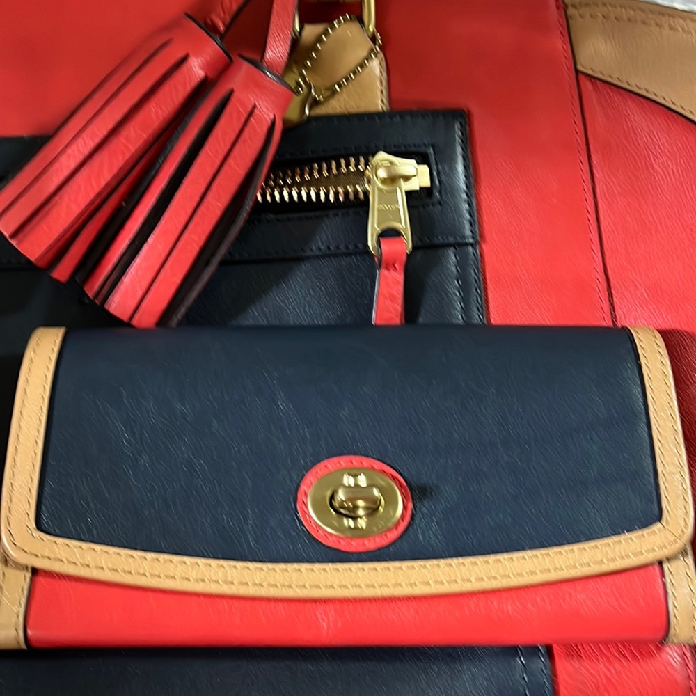 Coach Leather Envelope-billfold in Navy ,Red and Tan. Gold latch on front. NWT